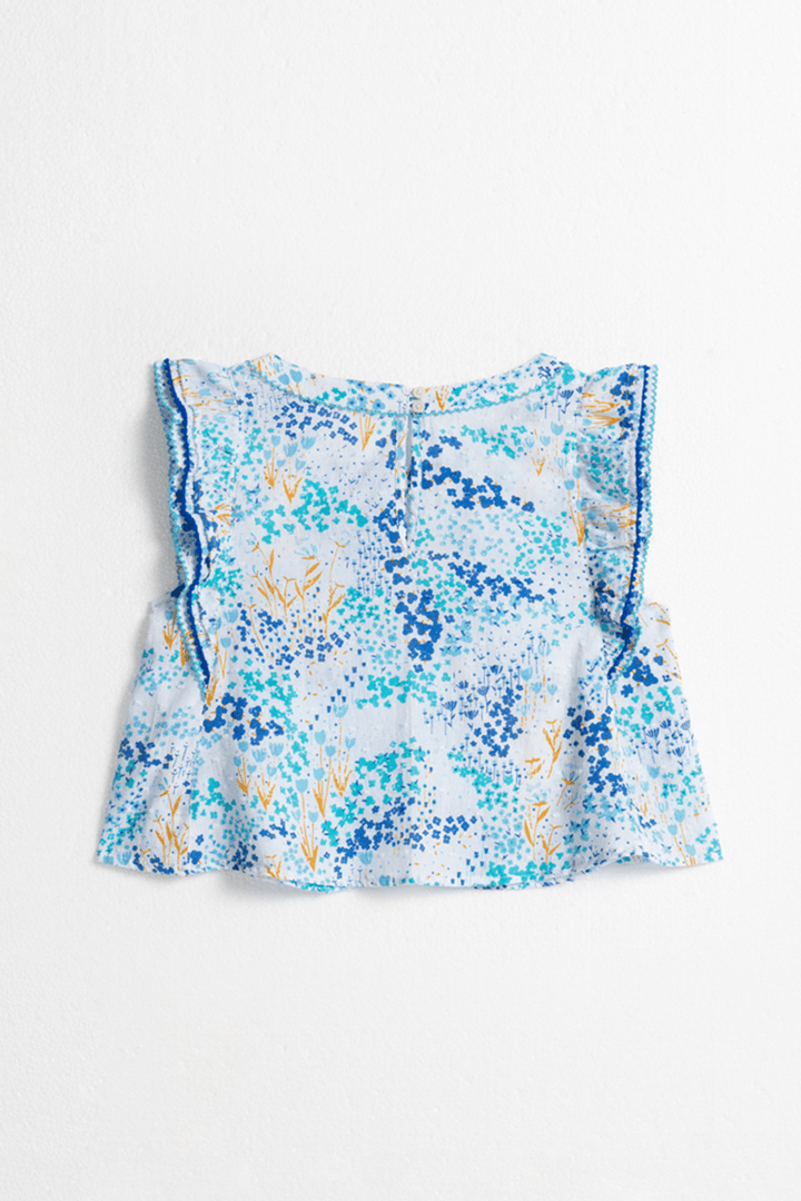 Back view of Poupette St Barth Kids Adeh top in white and blue tulip design, featuring a casual shirt for children.