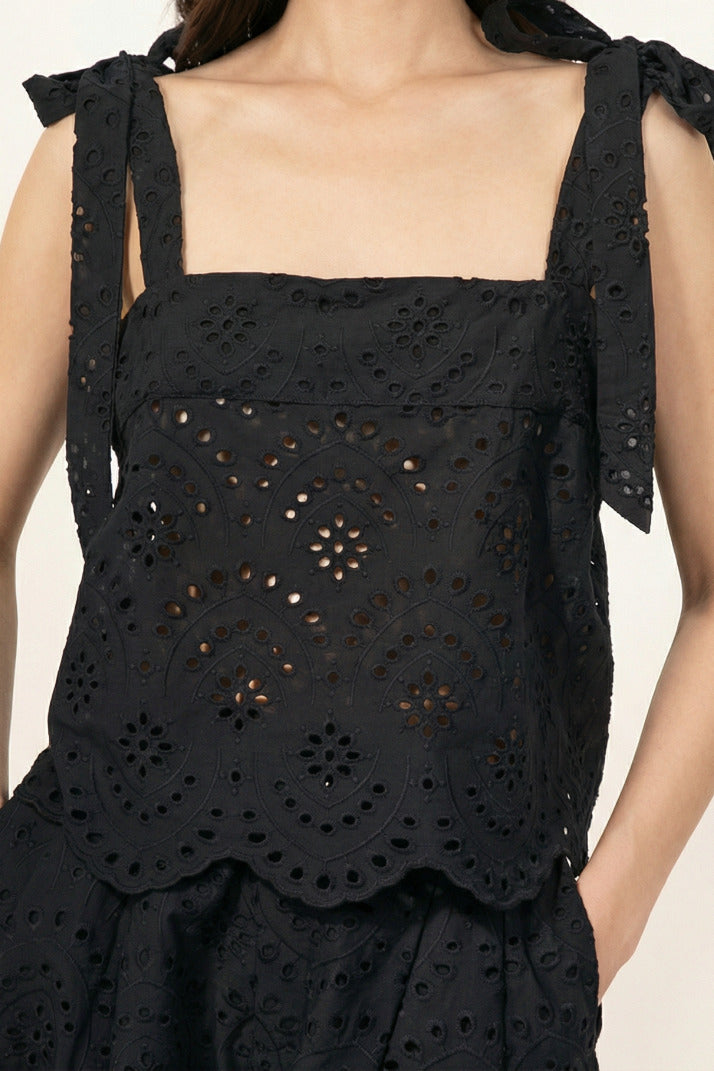 Black top – Top Noa by Poupette St Barth, front view with bow tie straps and eyelet embroidery
