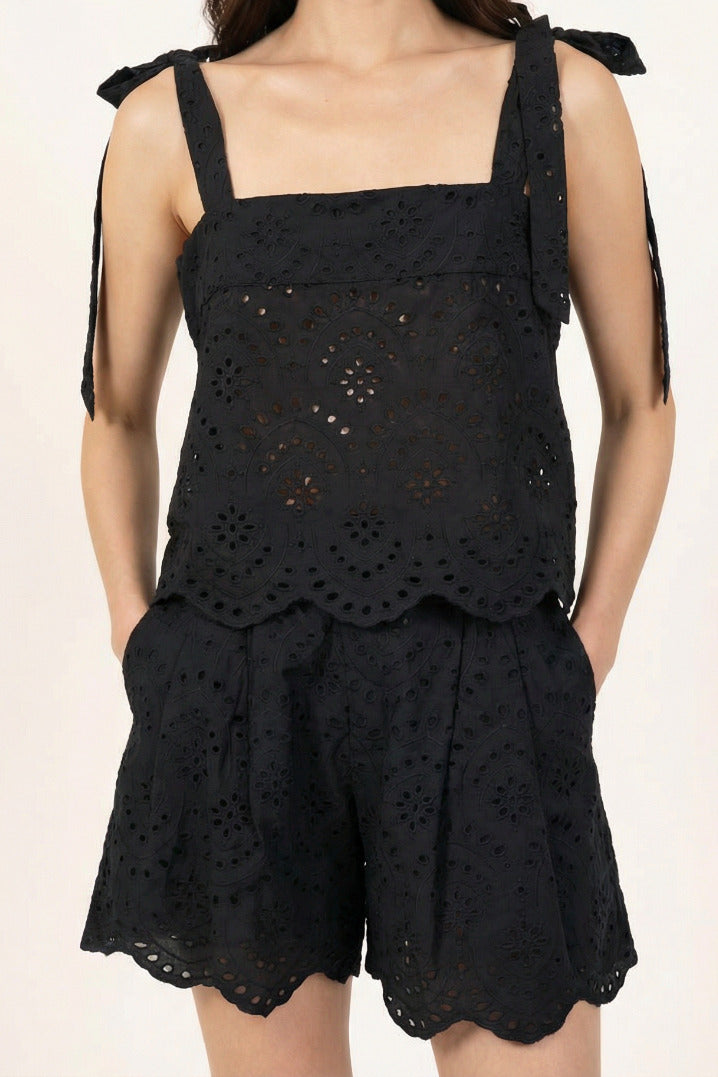 Black top – Top Noa by Poupette St Barth, styled with matching eyelet shorts