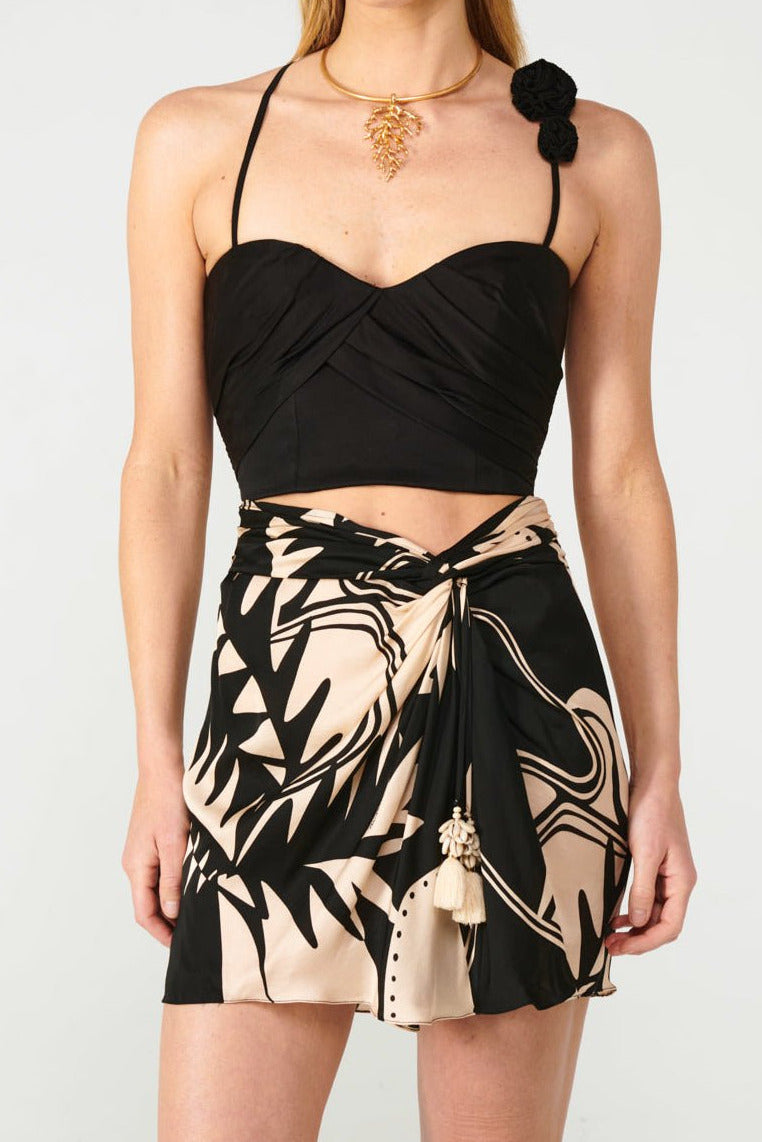 Black top – Top Palmire by Poupette St Barth, front view styled with printed wrap mini skirt
