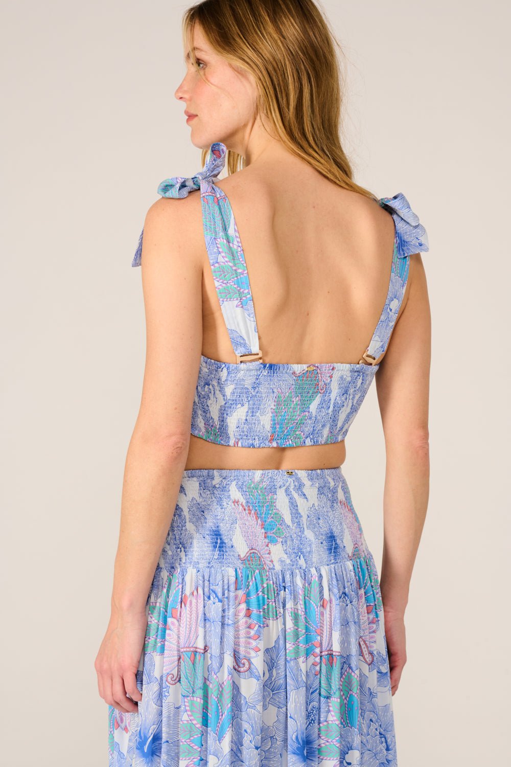 Blue Carla Top by Poupette St Barth featuring a long sleeve shirt in a vibrant Padang blue color.
