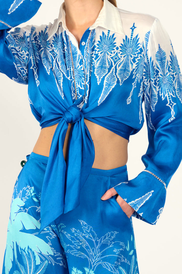 Blue Canopy shirt – Shirt Sidonie by Poupette St Barth, front view tied at the waist, styled with pants