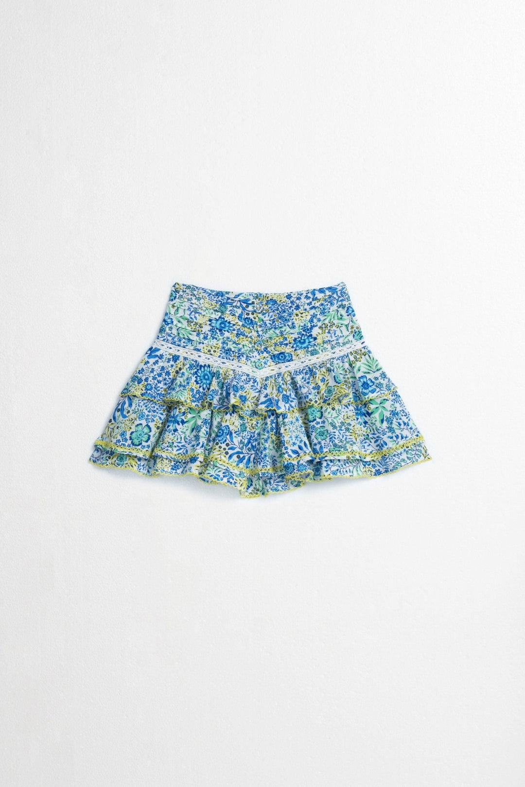 Kids mini skirt by Poupette St Barth in white and blue nature print, featuring a lightweight viscose fabric and front view.