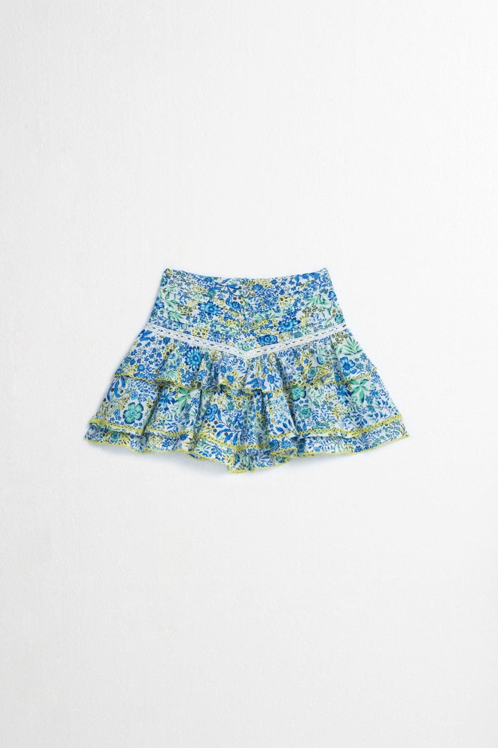 Kids mini skirt by Poupette St Barth in white and blue nature print, featuring a lightweight viscose fabric and front view.