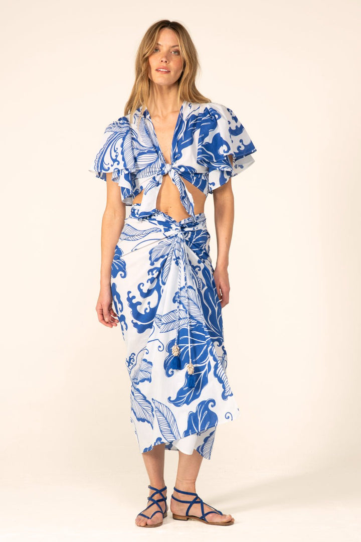 Blue Reef Wave long skirt by Poupette St Barth, flowing fabric with a vibrant blue and wave-inspired pattern.