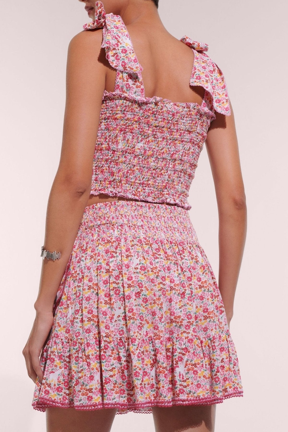 Pink Jardin Mini Skirt by Poupette St Barth, lightweight viscose skirt with a stylish mini length and vibrant floral pattern.