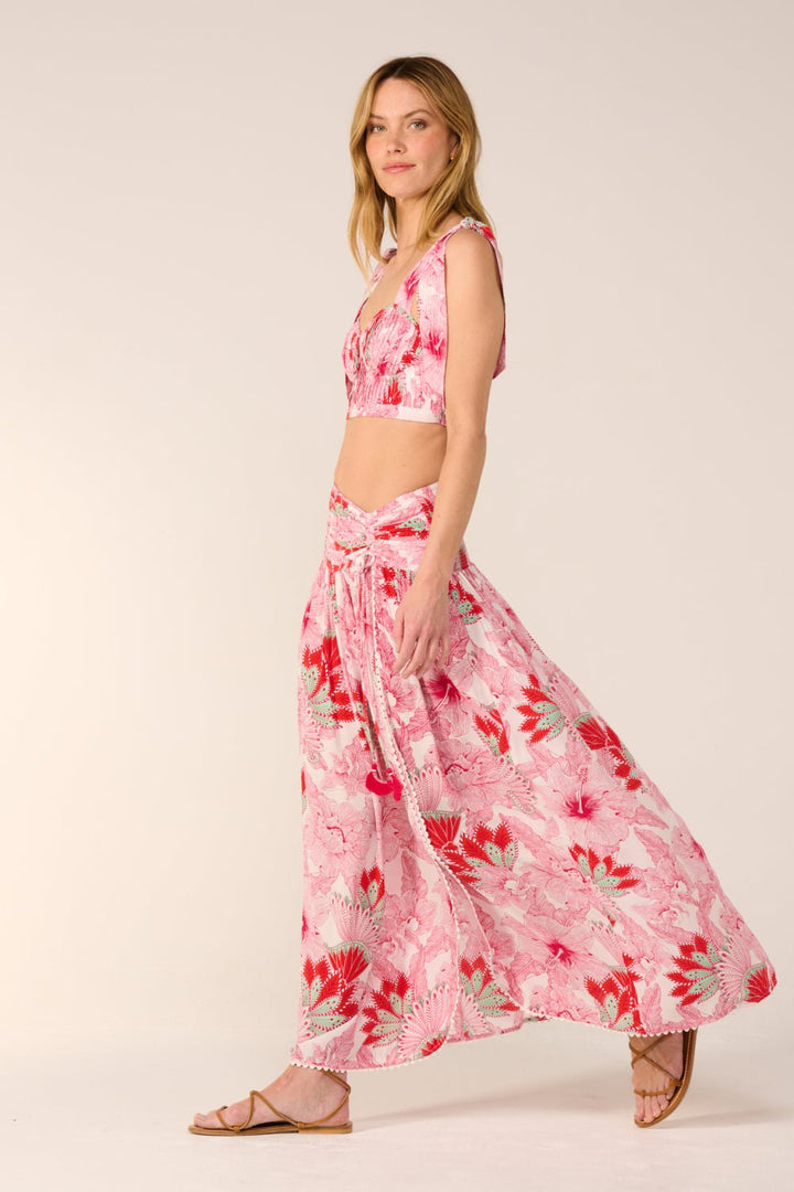 Pink Carla long skirt by Poupette St Barth featuring a flowing fabric and elegant design, displayed on a model.