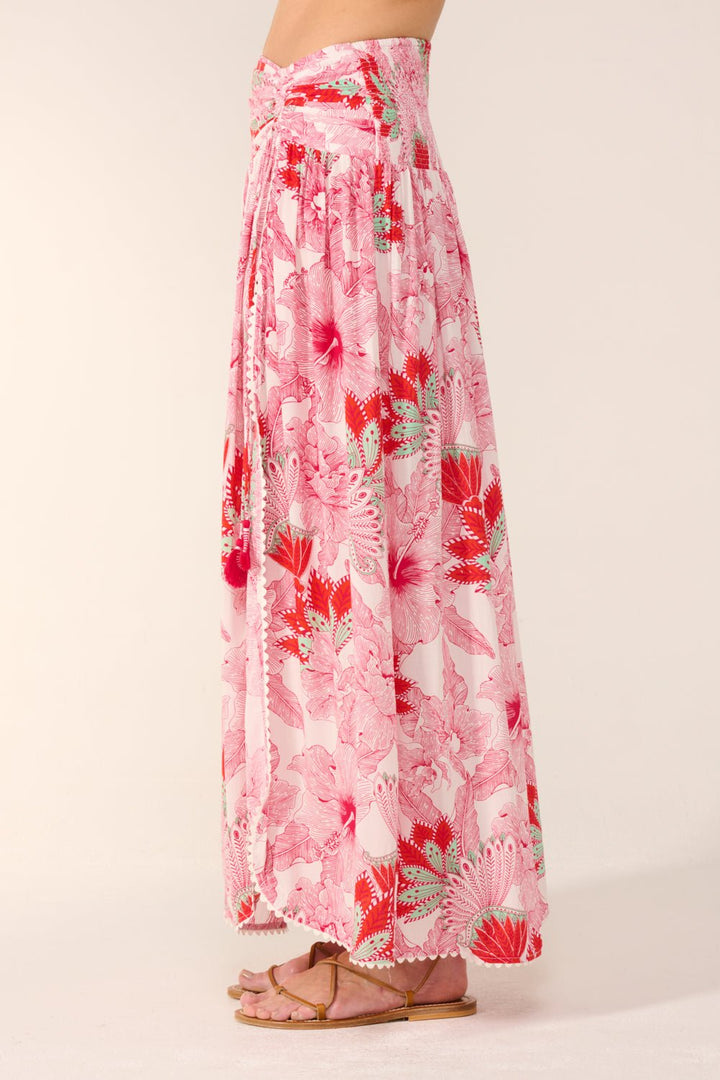 Pink Carla long skirt by Poupette St Barth with flowing fabric and stylish design, perfect for casual or dressy occasions.