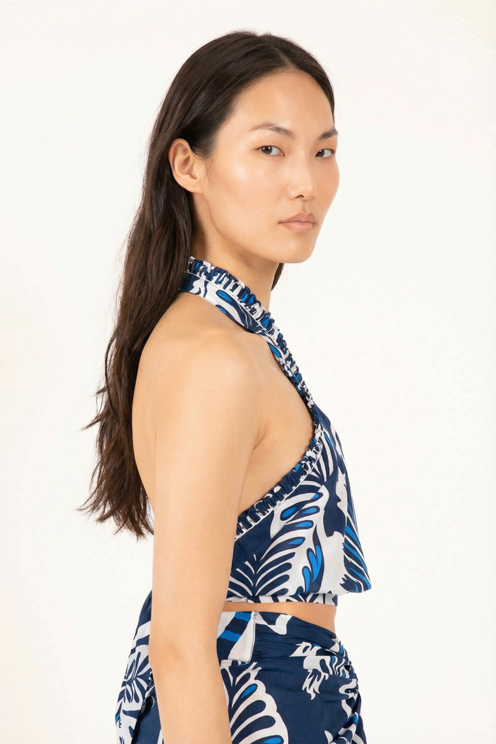 Navy Top Suma by Poupette St Barth featuring a stylish sleeveless design and lightweight fabric, perfect for warm weather.