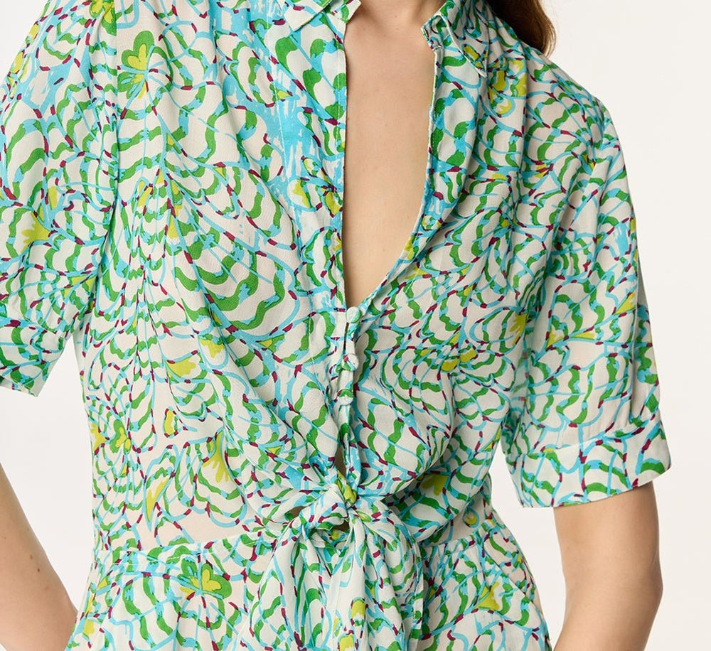Green viscose short jumpsuit Bettina by Poupette St Barth featuring a floral Wings Flower pattern.