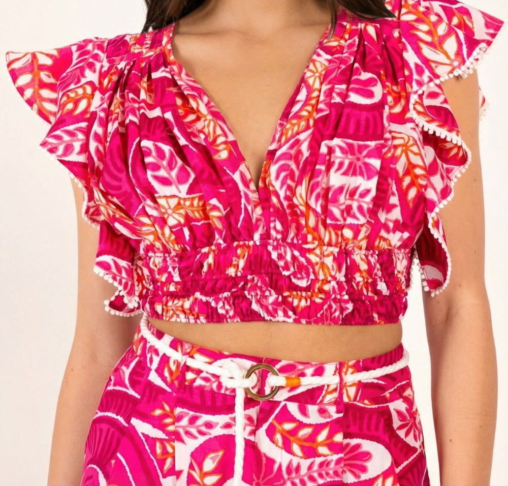 Pink cotton top by Poupette St Barth featuring a snake print and pearl details, styled as a casual, chic women's top.
