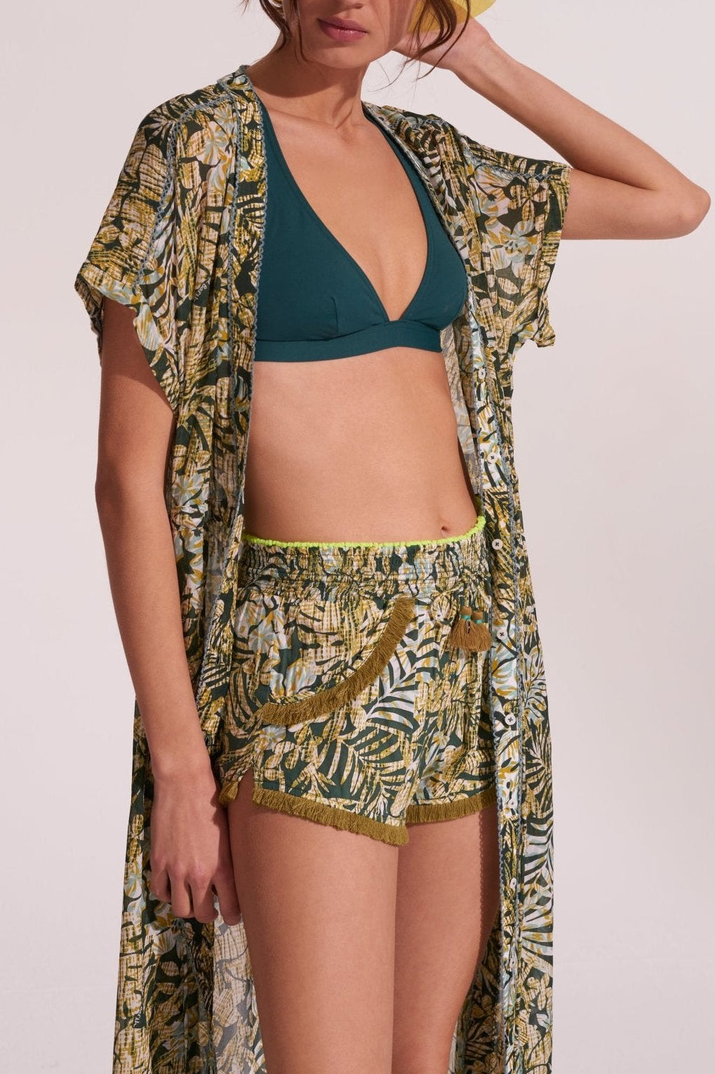 Green tropical boxer shorts by Poupette St Barth featuring tropical print and comfortable fit, styled with a long tunic.