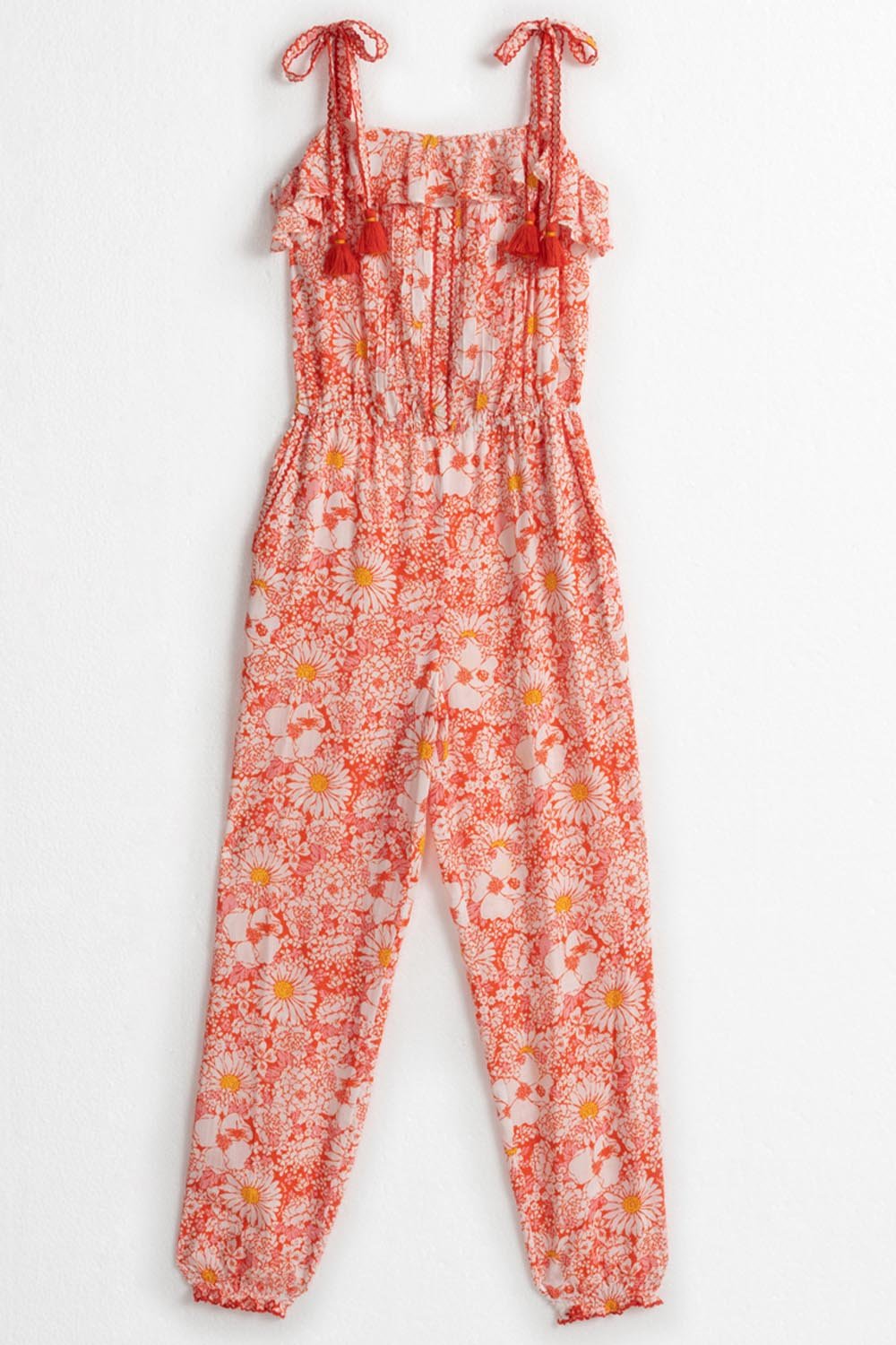 Orange kids' long jumpsuit Astra by Poupette St Barth featuring a mid-70s garden print, front view of the stylish jumpsuit.