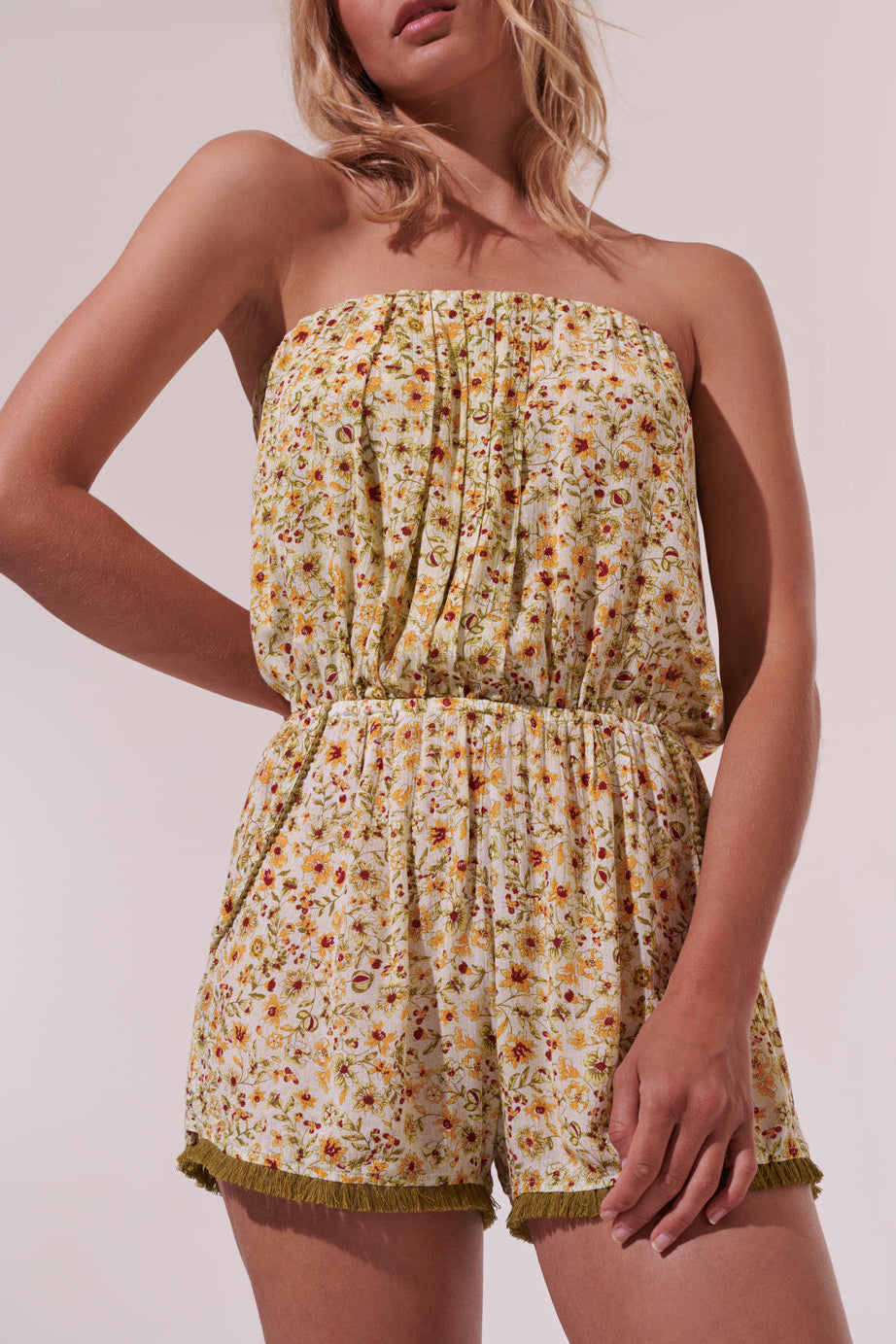 Green Ambra short jumpsuit by Poupette St Barth featuring a relaxed fit and vibrant floral magnolia print.