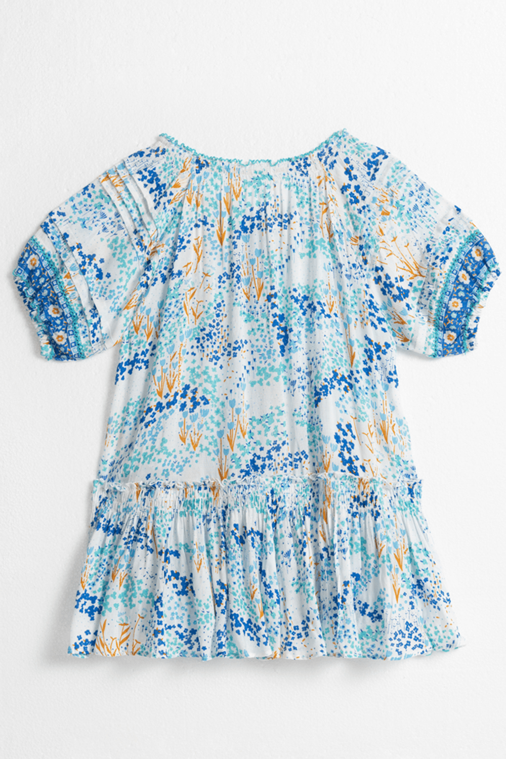 Kids mini dress Andrea by Poupette St Barth featuring a white and blue tulip pattern, shown from the back view.
