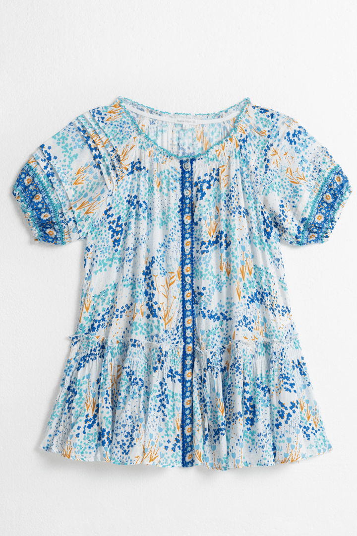 Kids mini dress by Poupette St Barth featuring a white and blue tulip pattern, shown from the front.