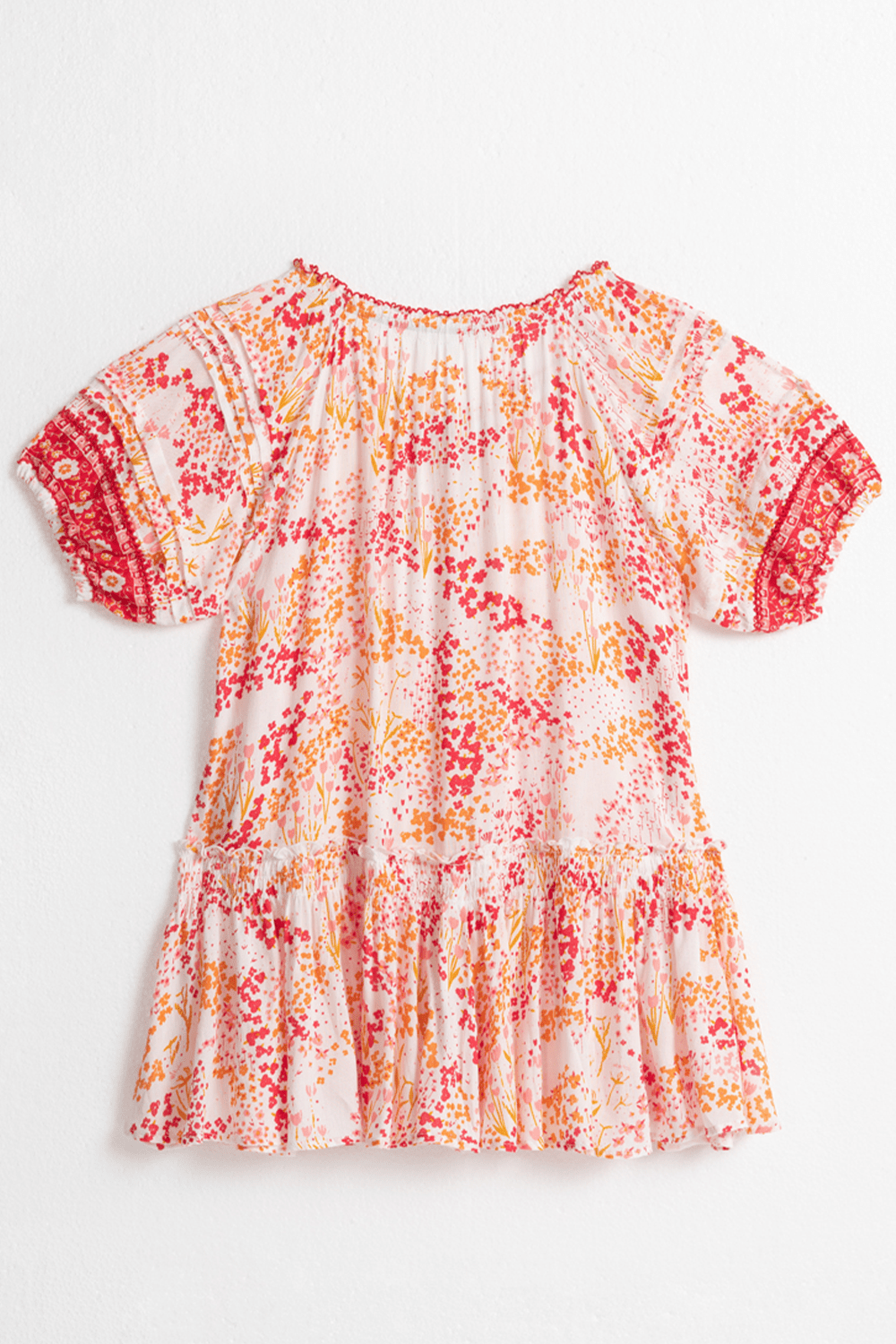 Back view of Poupette St Barth Kids Mini Dress Andrea in white with pink tulip pattern, featuring a playful, charming design.