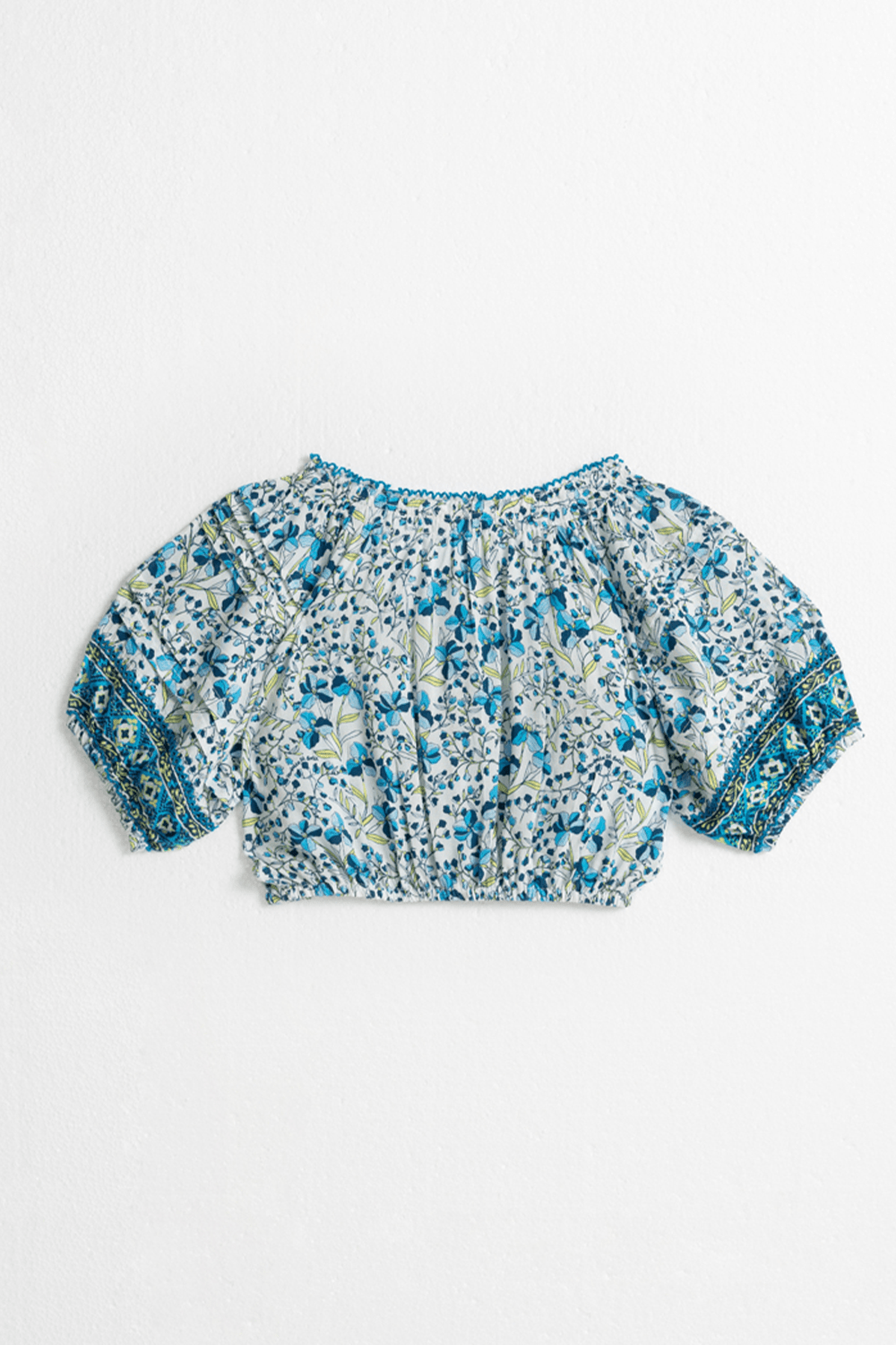 Back view of Poupette St Barth Kids Top Andrea Mini Jonquille in vibrant blue, featuring a stylish short-sleeve design for children.