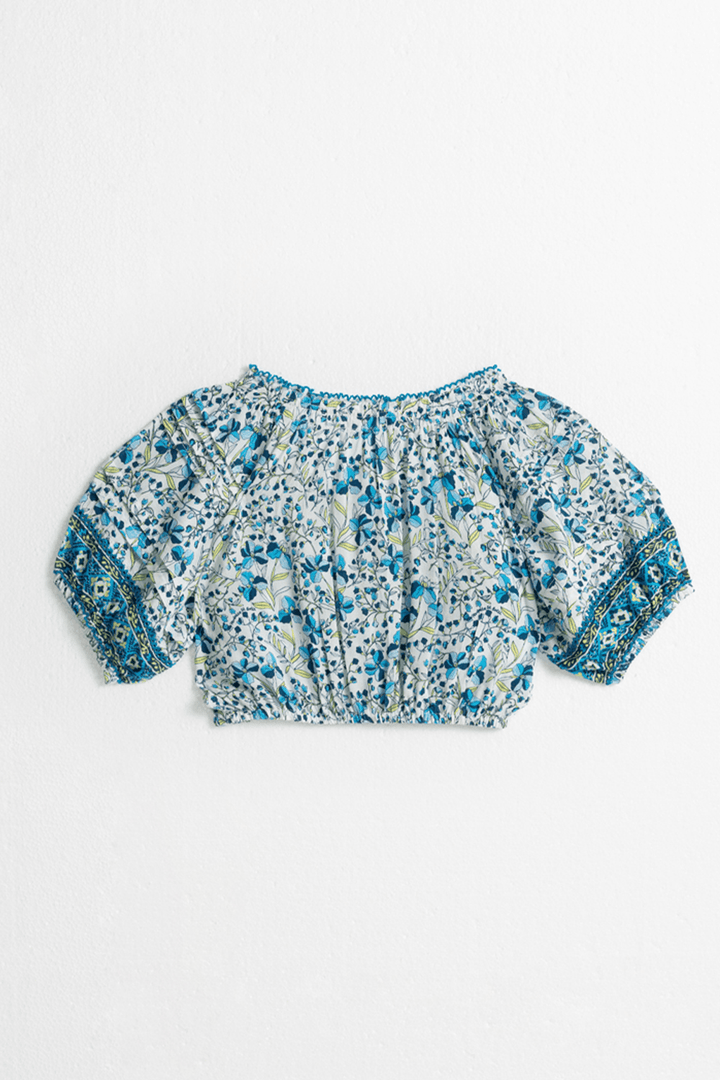 Back view of Poupette St Barth Kids Top Andrea Mini Jonquille in vibrant blue, featuring a stylish short-sleeve design for children.