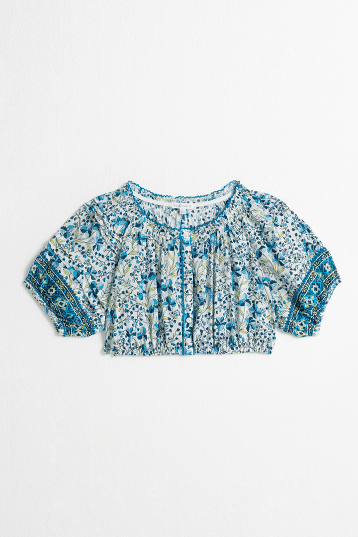 Blue kids' top Andrea by Poupette St Barth featuring a stylish mini jonquille pattern, shown from the front.