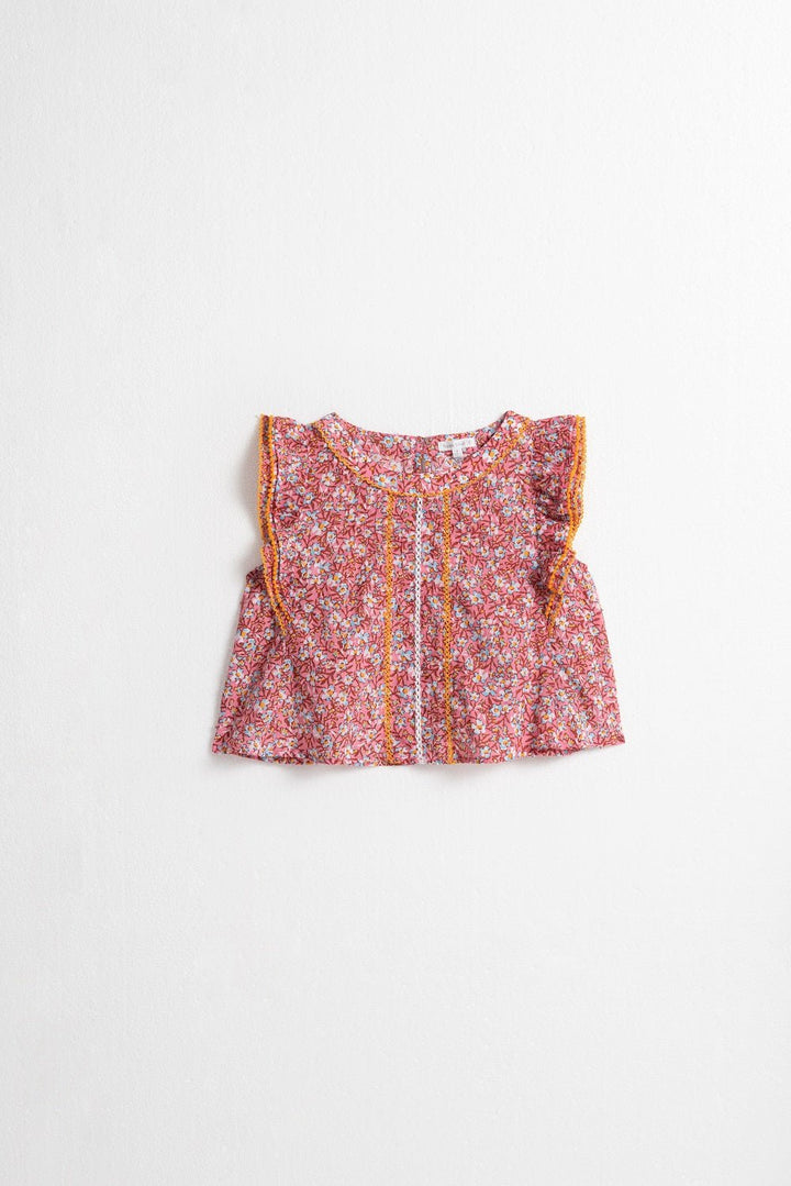 Kids pink paquerette top by Poupette St Barth, light pink shirt with floral design, front view of the children's top.