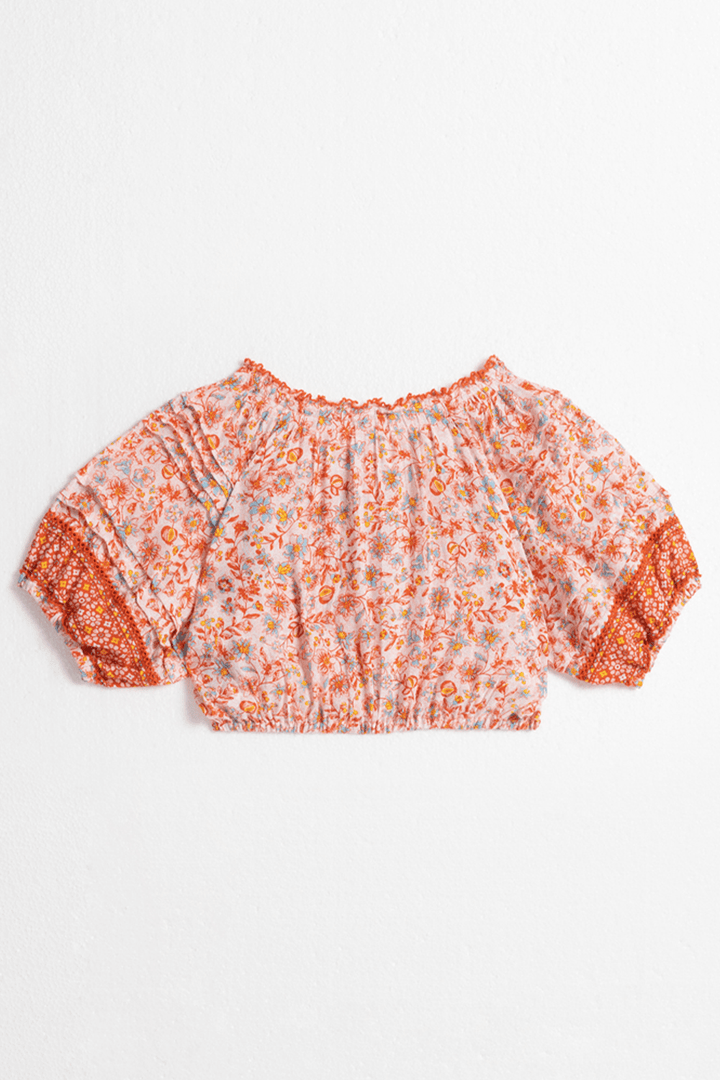 Back view of Poupette St Barth Kids Andrea Pink Magnolia top, a stylish pink shirt for children with a comfortable fit.