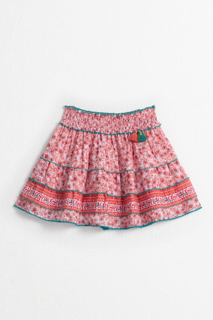 Kids mini skirt by Poupette St Barth, Ariel Pink Anemone, front view showing lightweight fabric and playful design.